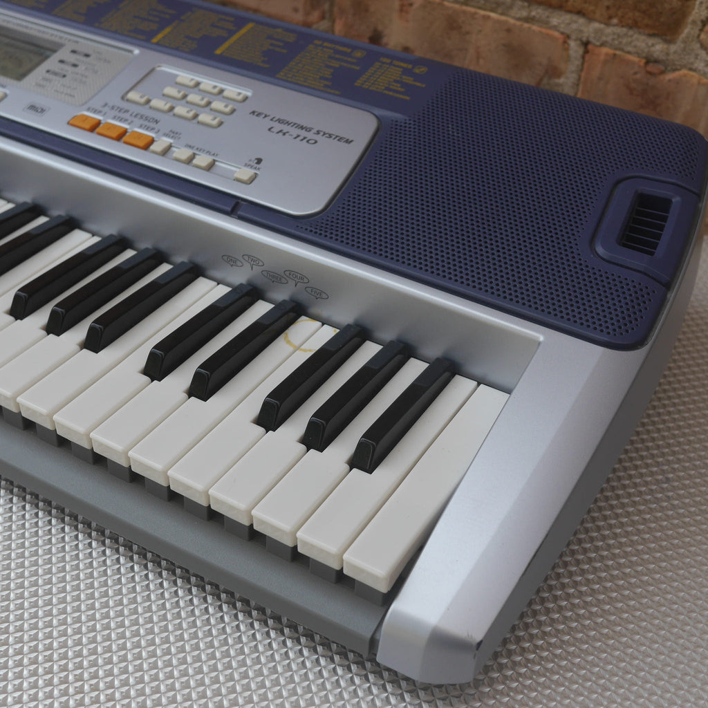 Casio LK-110 61-Key Key-Lighting Keyboard used