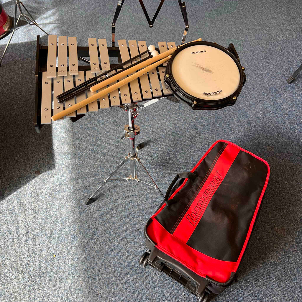 Ludwig Bell kit with drum pad sticks mallets and rolling bag.  (used)