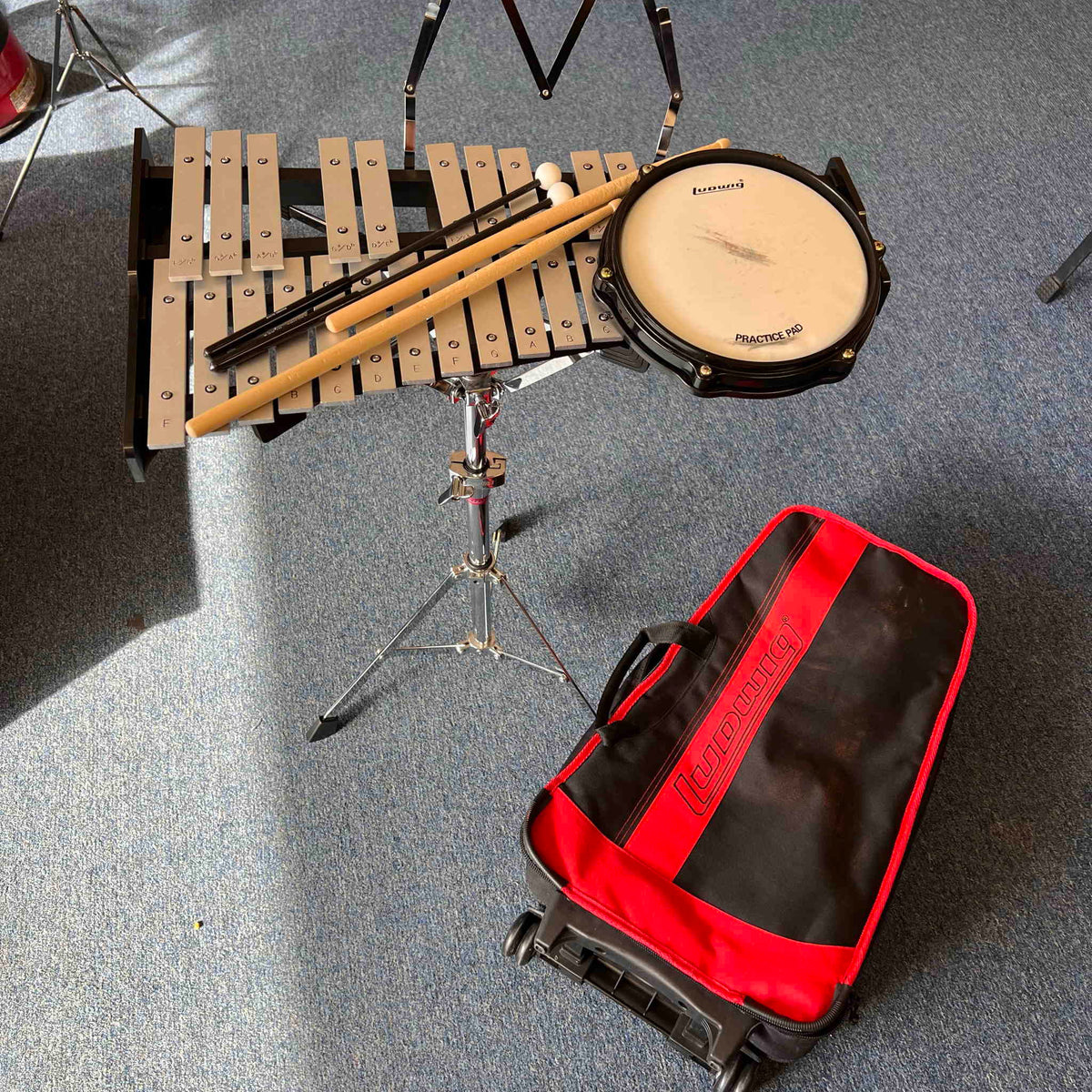 Ludwig Bell kit with drum pad sticks mallets and rolling bag.  (used)