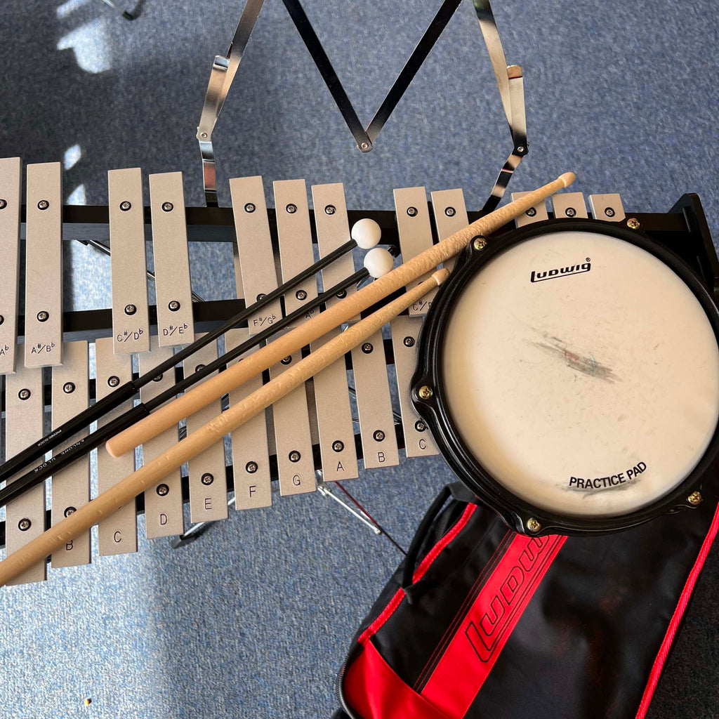 Ludwig Bell kit with drum pad sticks mallets and rolling bag.  (used)