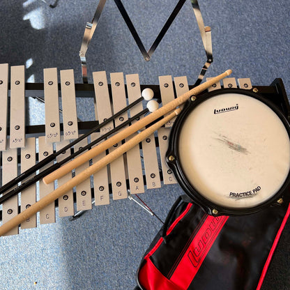 Ludwig Bell kit with drum pad sticks mallets and rolling bag.  (used)