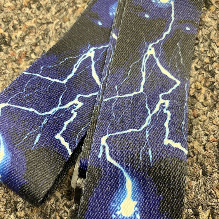 Classic lightning storm guitar strap, used