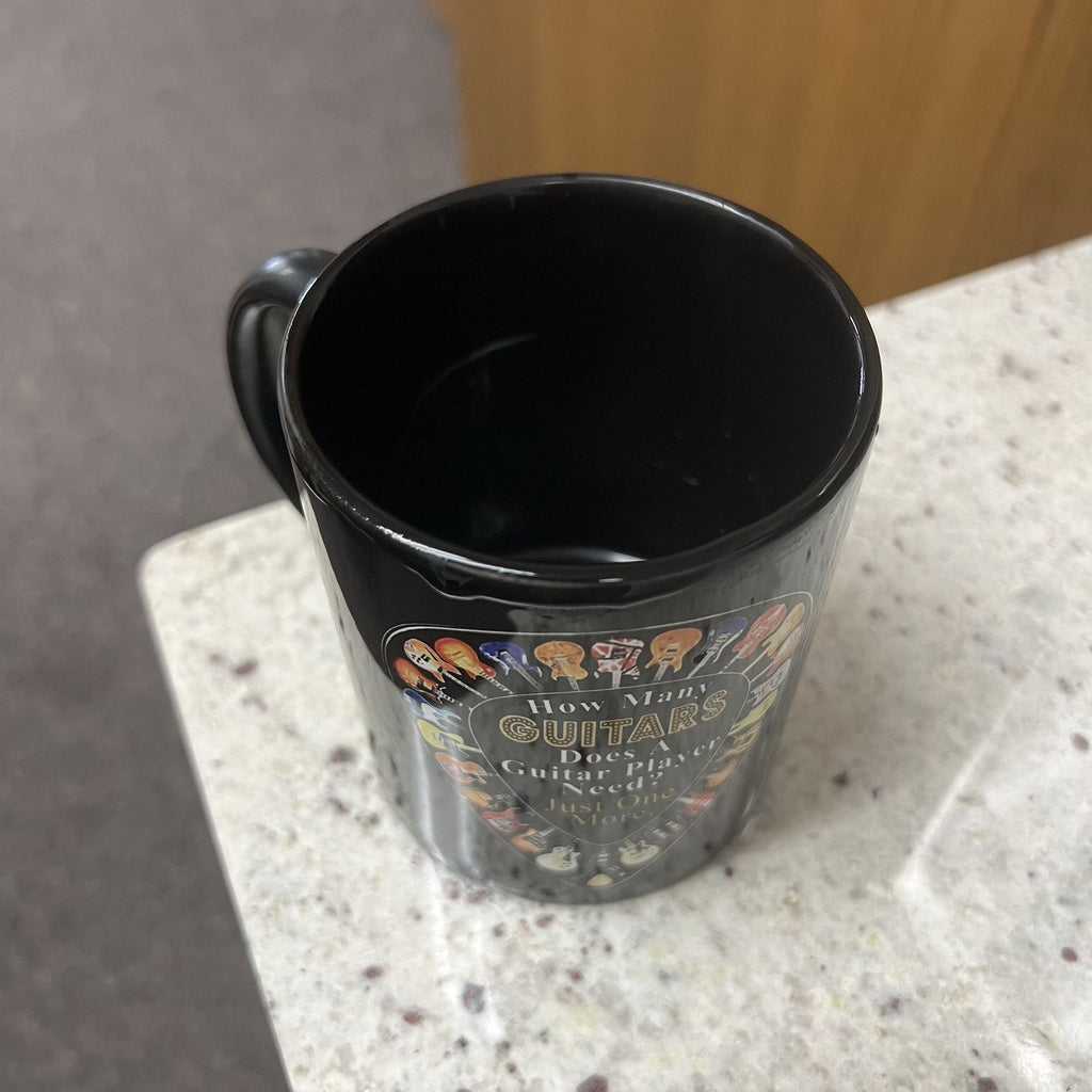 How Many Guitars does a guitar player need?  Coffee Mug